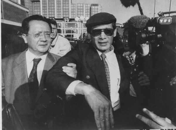 French National Charles Sobhraj leaves the court together with his lawyer Jacques Verges. Sobhraj who has linked to several unsolved murders in Asia in the 1970s, was charged with poisoning his return to France after spending 20 years in Indian Jails. (Express photo)