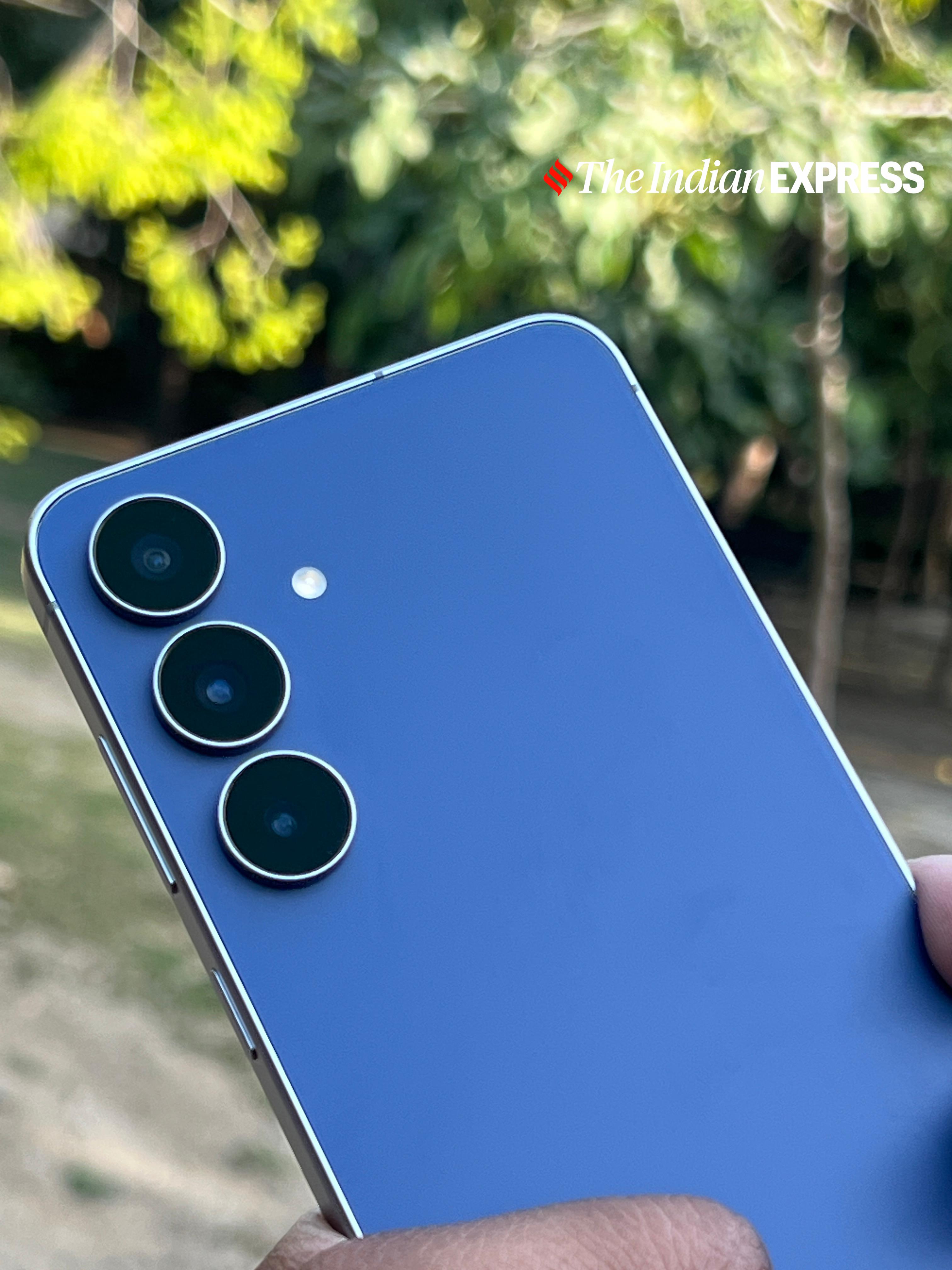 The Galaxy S25 FE’s triple-lens setup stands out against its matte navy blue back. (Image: Bijin Jose/The Indian Express)