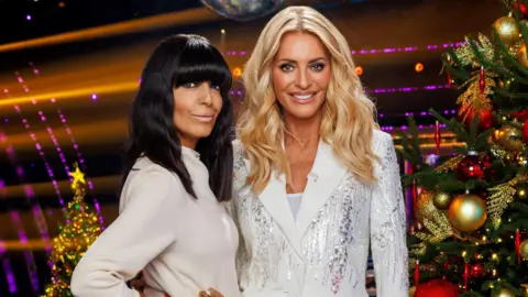 Claudia Winkleman and Tess Daly dressed in white, pictured on the Christmas Special