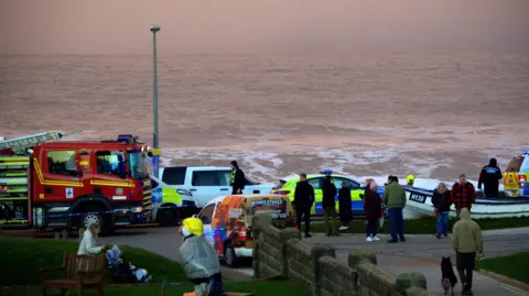 Darrin Stevens Shot of a fire engine, police car and emergency workers on the seafront in Withernsea.